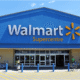 Walmart storefront with signage and customers entering