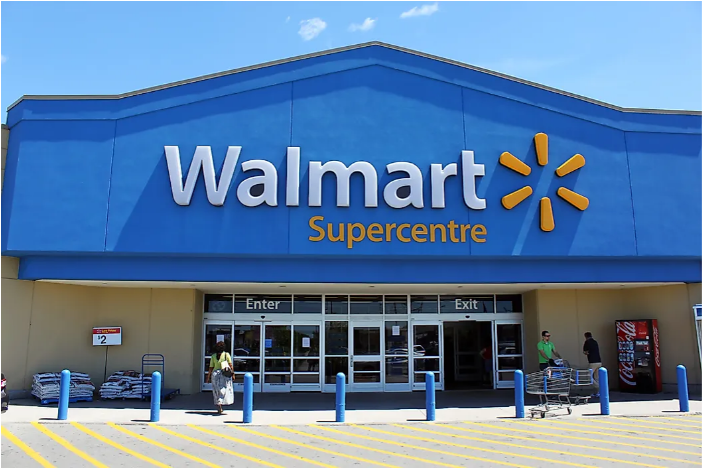 Walmart storefront with signage and customers entering